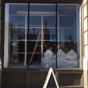 Display artists creating a Retailworks Inc. window display in Milwaukee